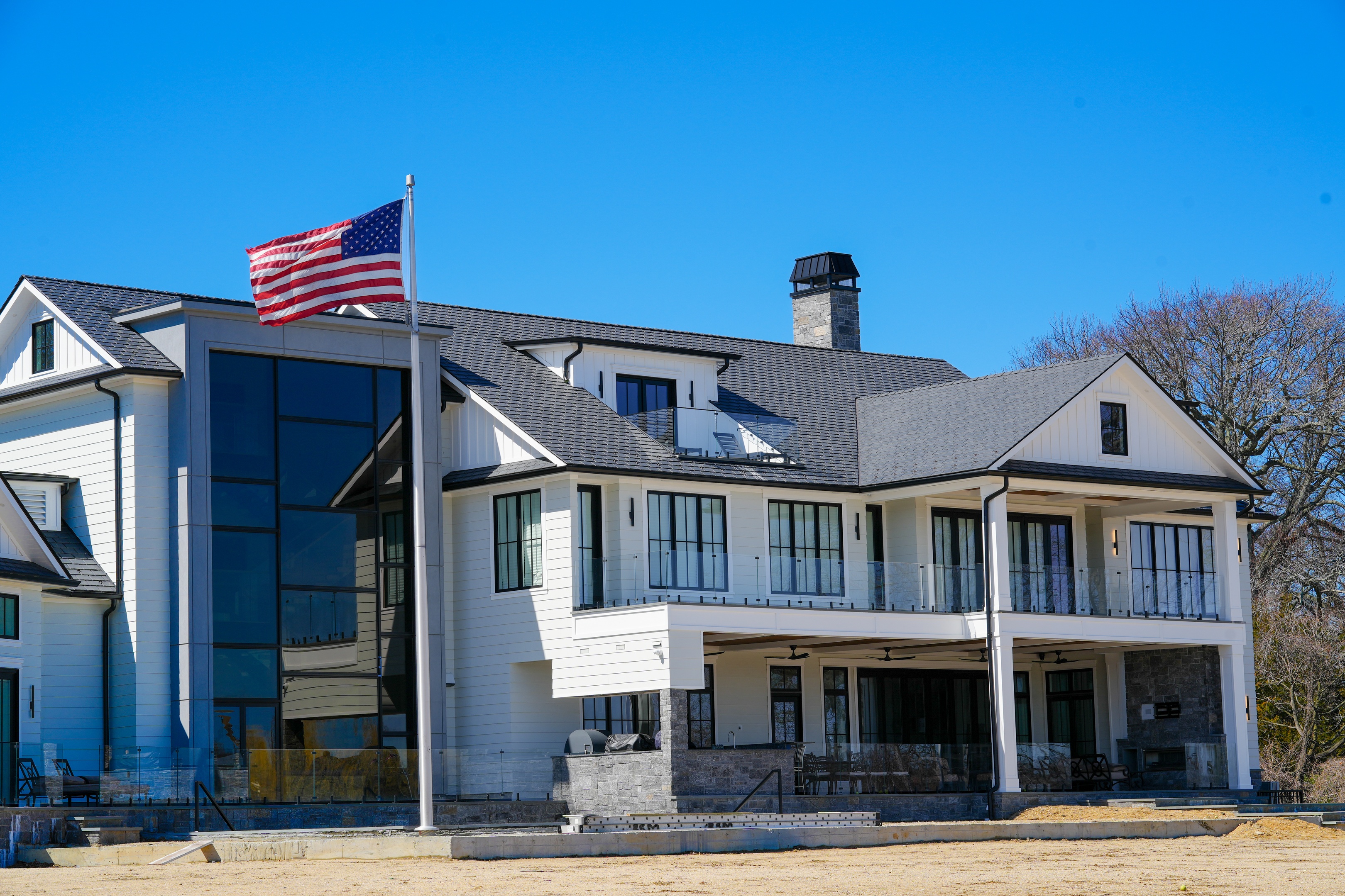 man in green t-shirt and green pants standing on black metal frame